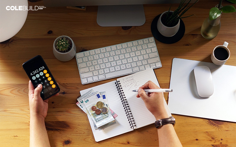 person computing costs and expenses